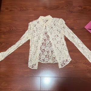Button up long sleeved lace shirt.